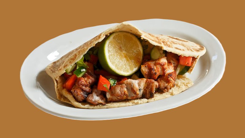 1ec3a62a-2539-11ed-9781-12f6354d13ae_pork_skewer_in_cypriot_pita (1).jpg