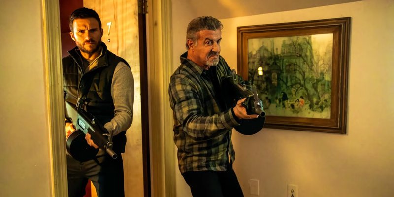 sylvester-stallone-and-scott-eastwood-hold-shotguns-in-alarum.jpg